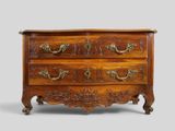 an antique chest of drawers with ornate carvings and brass handles