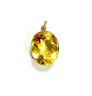 an image of a yellow diamond pendant on a white background