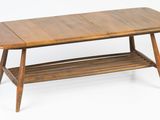 a wooden table with a shelf underneath it on a white background