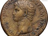 an ancient coin with a woman ' s head on it