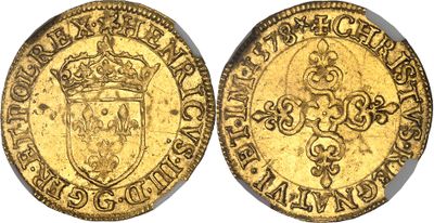 a gold coin with a crown on top of it