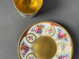 an image of a cup and saucer sitting on top of a table