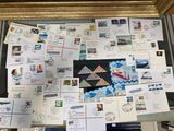 a picture of a collection of postcards and envelopes on a window sill