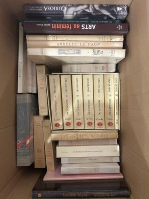 a box full of books sitting on top of each other