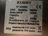 a label on the back of a machine that says roby