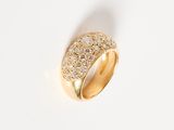 an image of a gold and diamond ring on a white surface