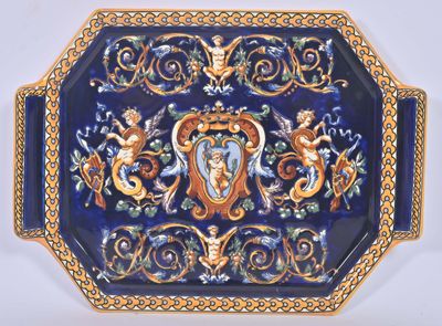 a blue and gold plate with a picture of a woman on it