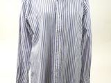 striped shirt on a mannequin stand against a white background