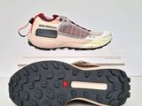 salomon women ' s trail running shoes in pink and white