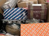 a cardboard box full of ties and other items in it