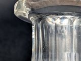 a glass vase that is sitting on a table