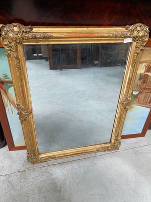 large antique gold framed mirror