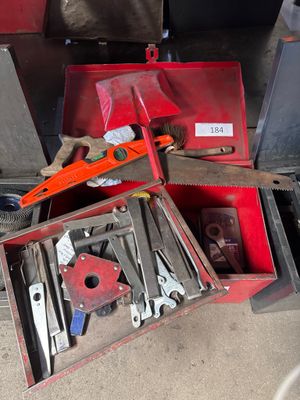 many tools in a red box on the floor