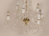 a crystal chandelier hanging from a ceiling in a room
