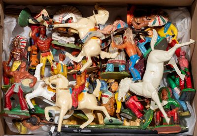 a box full of toy figurines of horses and horses