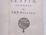 un livre ouvert sur lequel figure l'image d'un compas