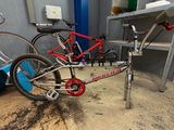 two bikes that are parked in a garage