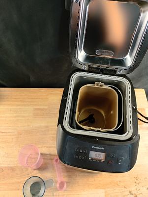 a small machine that is sitting on a wooden table