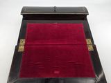an image of a black and red case with a red velvet lining