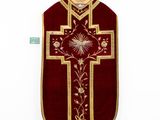 an image of a red and gold cross on a white background