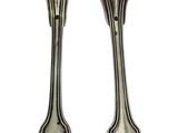 pair of silver plated forks and spoons on a white background
