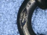 a close up of a metal object on a blue carpet