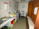 a kitchen with a sink and a stove in it