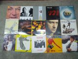 a lot of different album covers on the floor