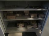 a cabinet with many boxes on it in a room