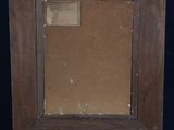 an old wooden easel with a painting on top of it