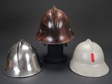 three helmets that are sitting on top of a table