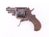 an old gun with a wooden handle on a white surface