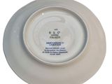 white plate with a blue and white design on it