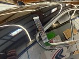 a close up of a car ' s side mirror with a sticker on it