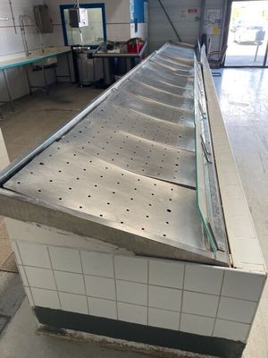 an image of a commercial kitchen with stainless steel counter tops