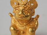 figurine en or représentant un singe coiffé d'une couronne