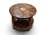 a wooden table with a circular top on a white surface