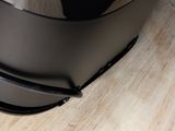 a close up view of a toaster on a wooden table
