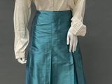 an image of a mannequin wearing a skirt and blouse