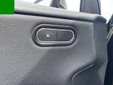 a close up of a car ' s interior with a remote control