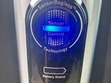 a bottle of water that has a blue light on it