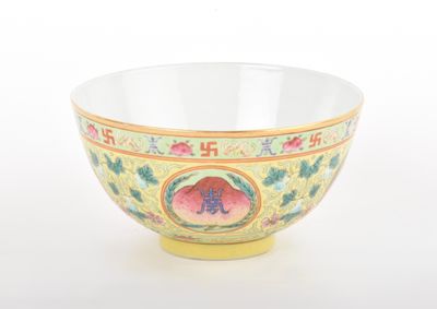 a yellow bowl with a floral design on it