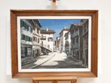a picture of a painting hanging on a easel in a room
