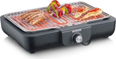 une photo d'un barbecue sur lequel cuisent de la viande et des légumes