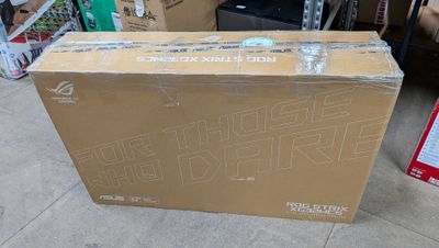 a box that is sitting on the floor in front of a pile of boxes