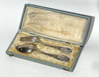 a silverware set in a box with a spoon and fork
