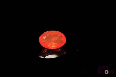 an image of a glowing red ball in the dark