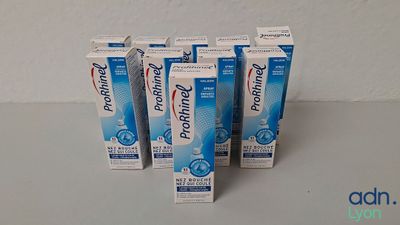 four tubes of toothpaste sitting on top of a table