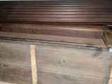 a wooden chest with a metal latch on it