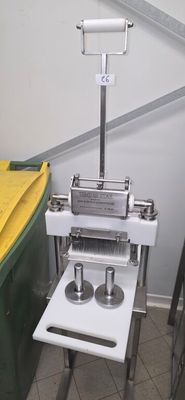 a machine that is sitting on a table next to a trash can